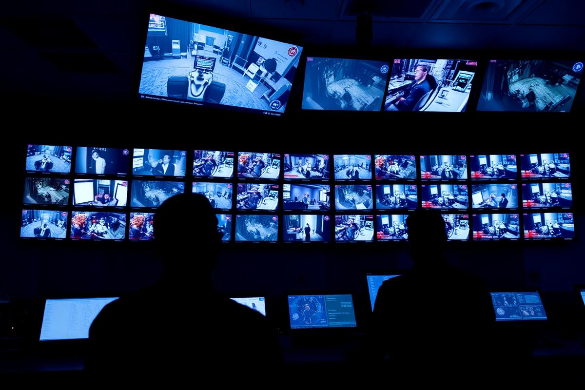 Casino surveillance control room with a wall of gaming floor camera feeds